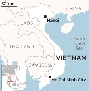 Map of Vietnam, bordered by China to the north, Laos and Cambodia to the west, and the South China Sea to the east. Major cities Hanoi and Ho Chi Minh City are marked