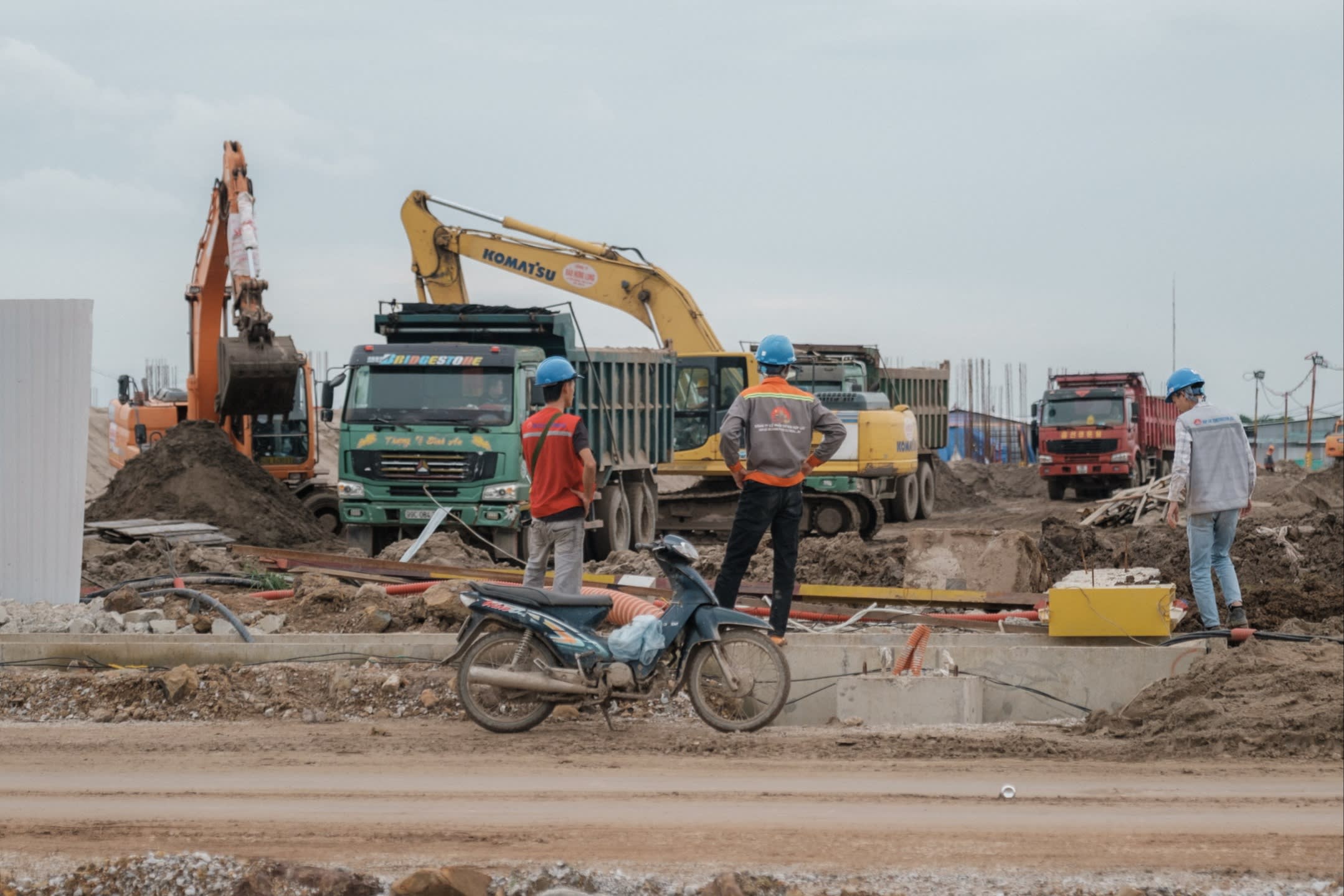 Earthmoving equipment clearing a site
