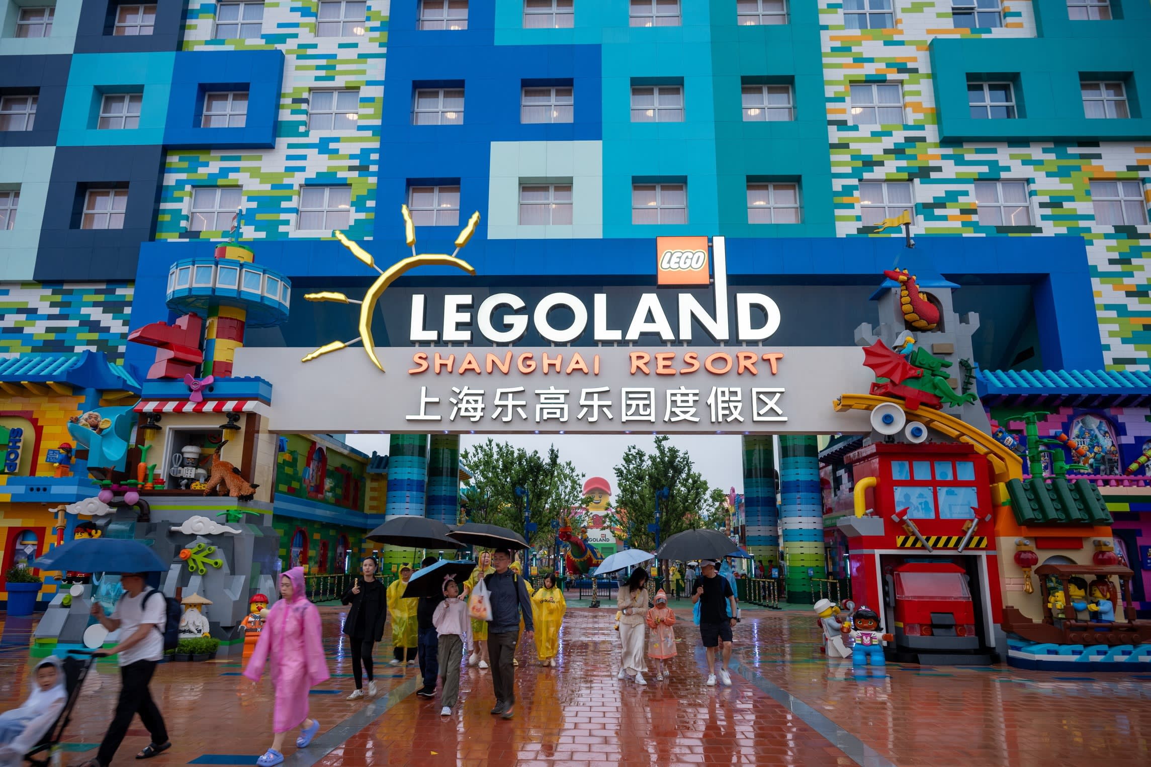 Tourists visiting the Legoland resort in the Shanghai resort in the rain