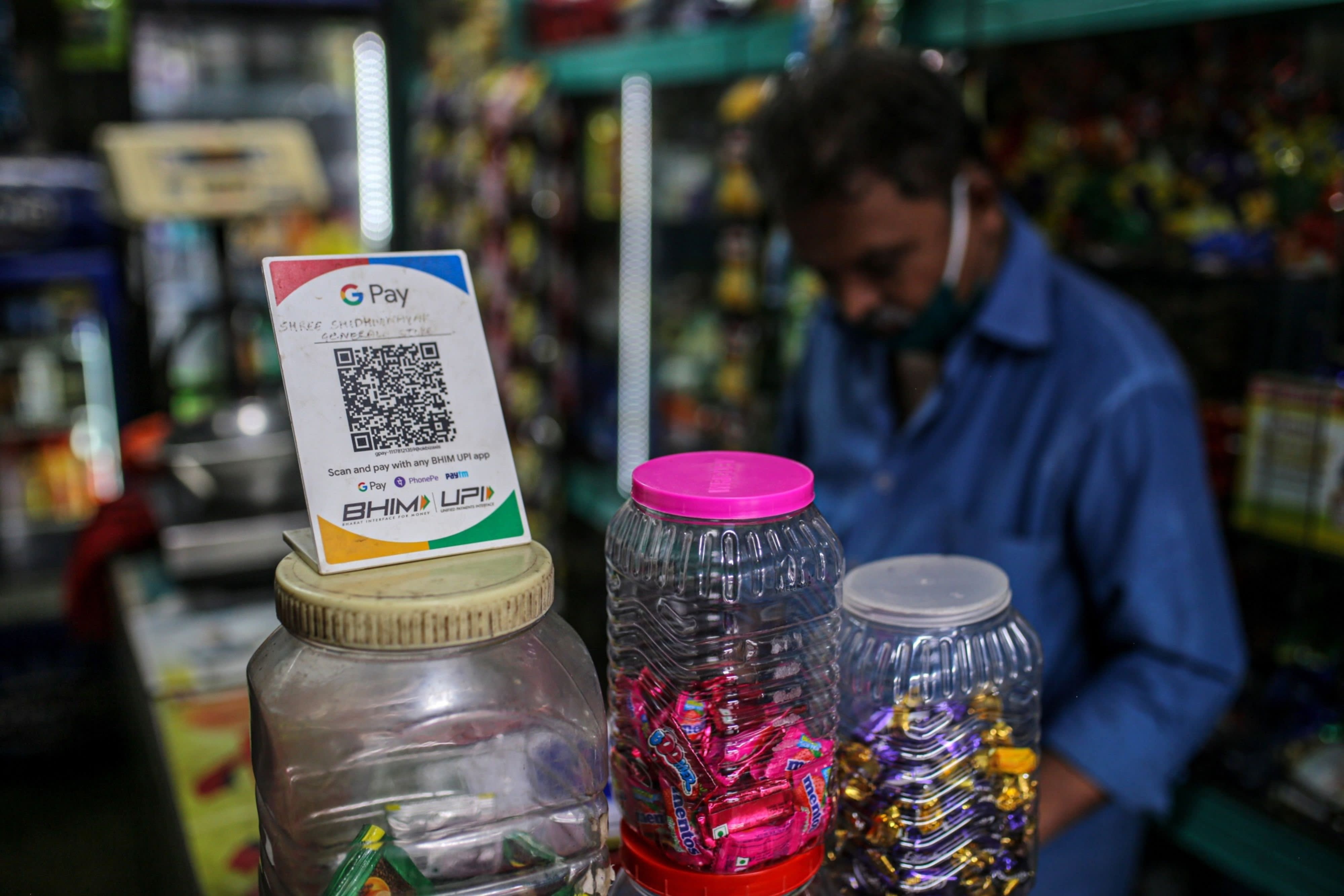 A general store advertises the use of the Google Pay digital payment system in Mumbai