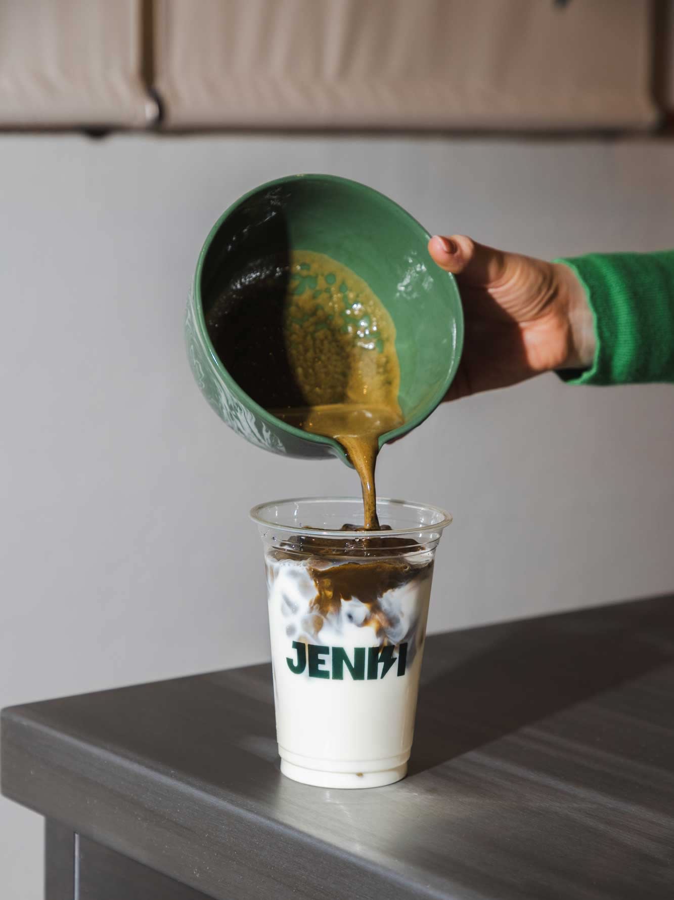 Making a hojicha latte at Jenki in London