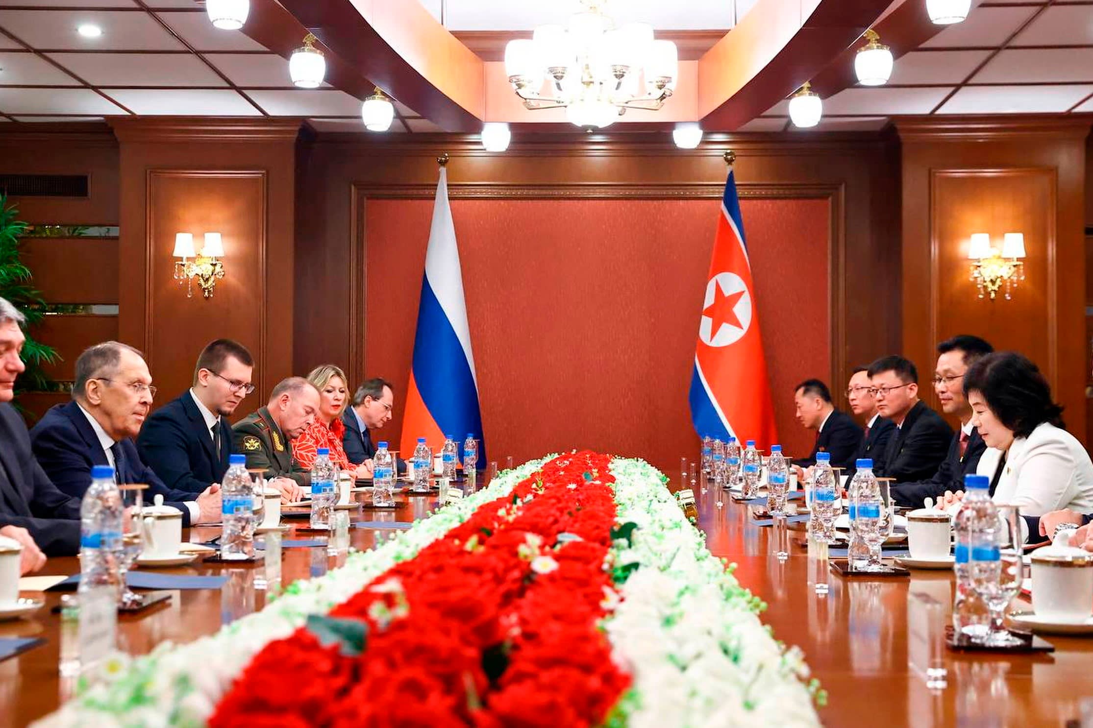 Sergei Lavrov, second left, attending talks with North Korean foreign minister Choe Son Hui, opposite, sitting around a table with their respective delegations, in Wonsan