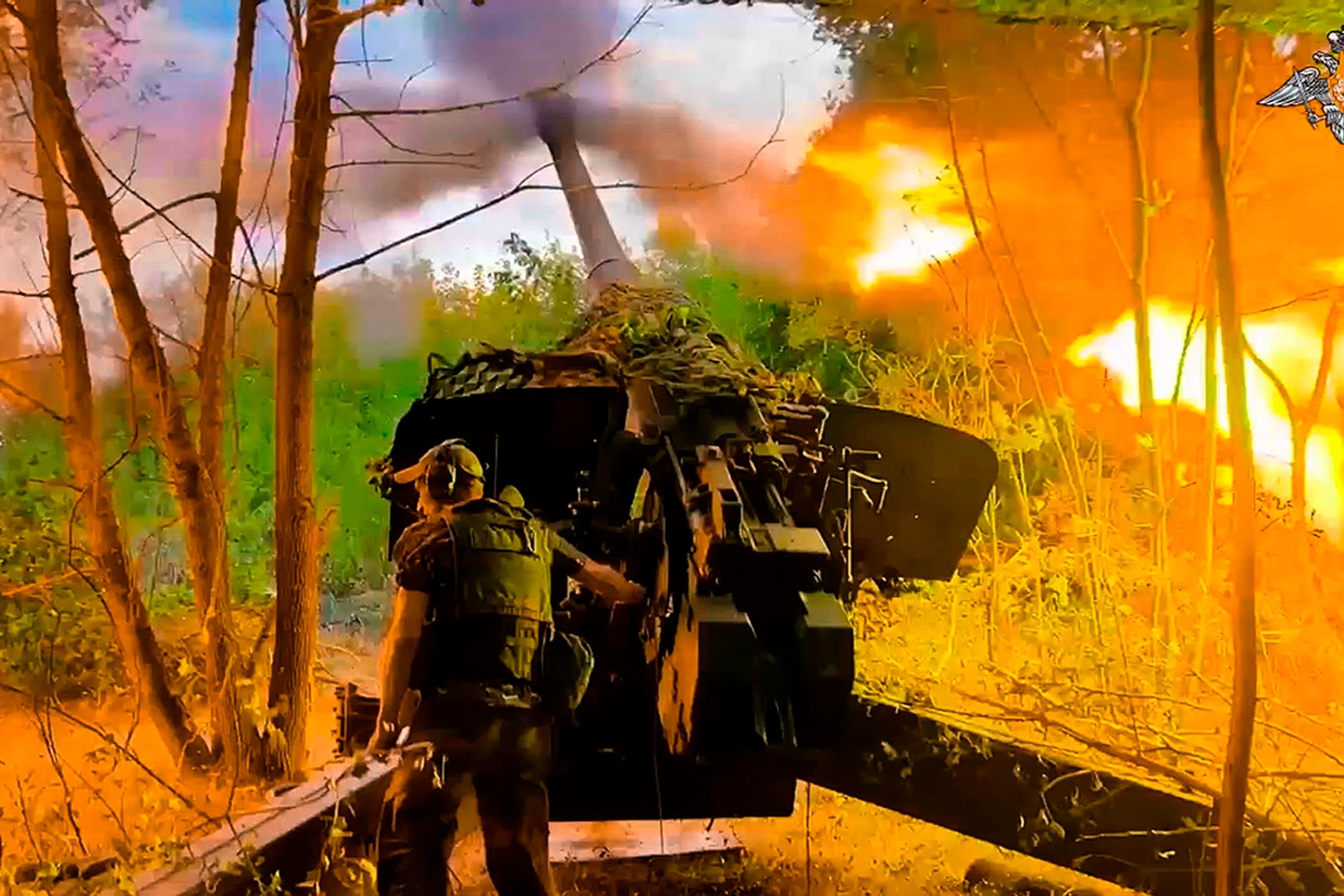 Russian troops firing towards a Ukrainian position near the border area of the Kursk region