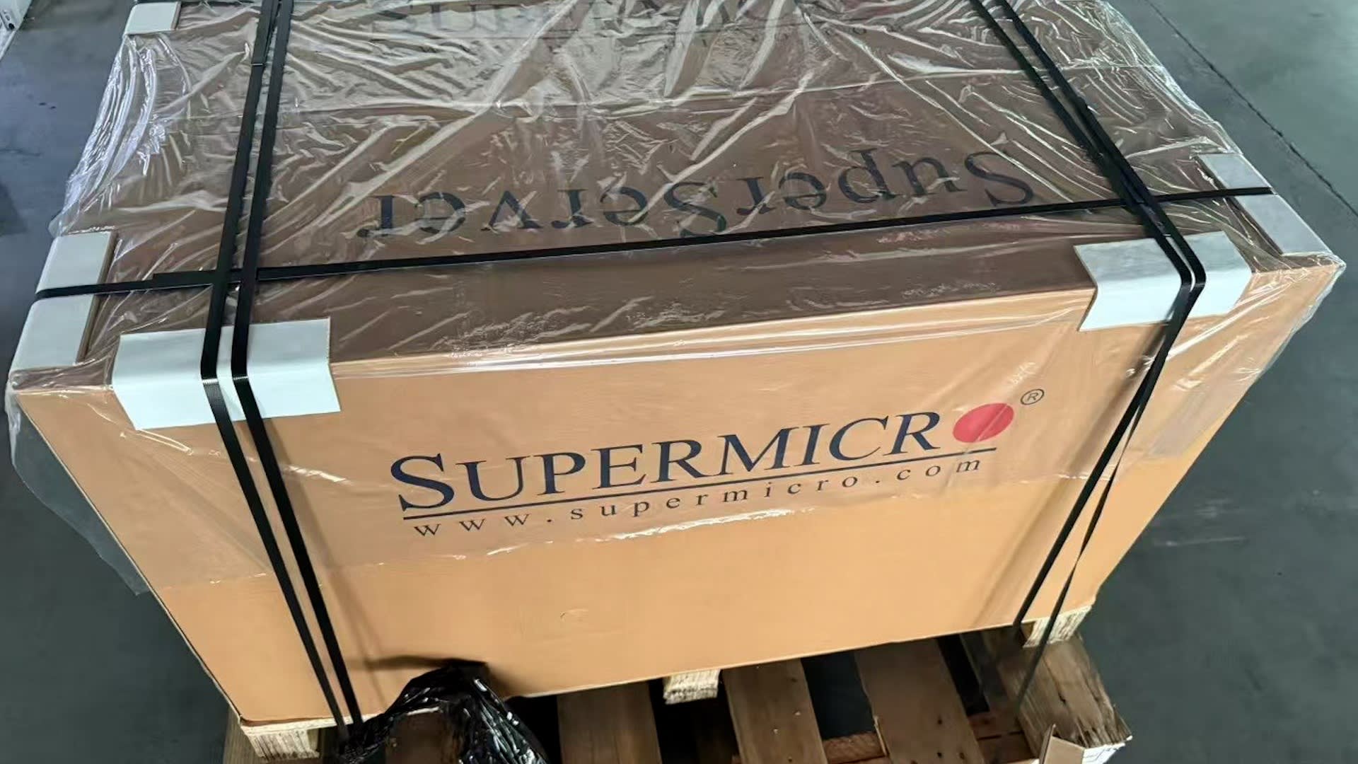 A large cardboard box with the Supermicro logo on its side