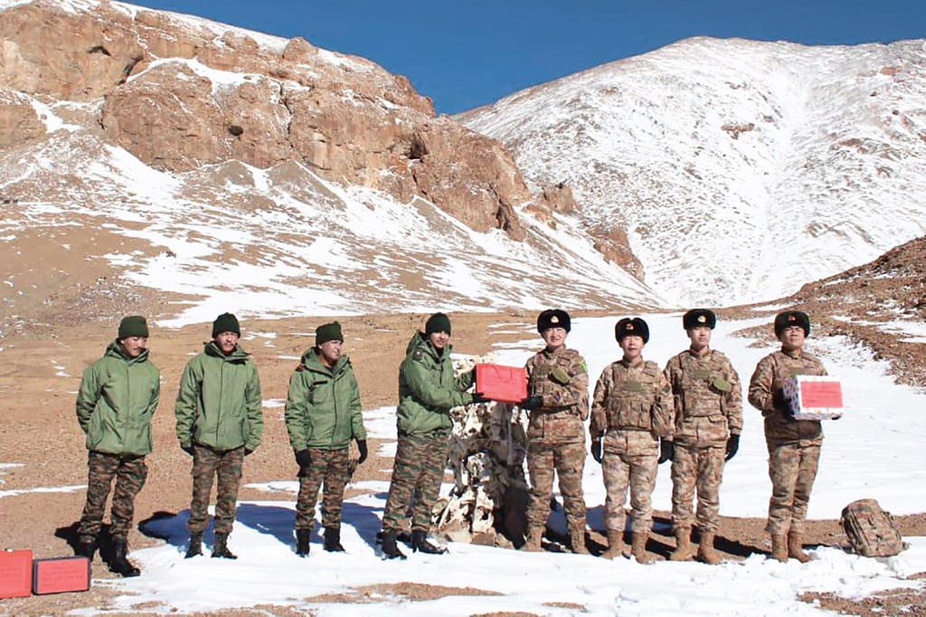 Indian and Chinese troops greet each other along the Line of Actual Control near the Karakoram Pass on October 31, 2024. Photo: Indian Army/AFP