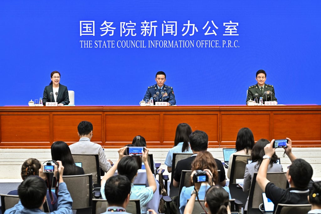 Wu Zeke, deputy head of the warfare bureau at the Central Military Commission’s Joint Staff Department (centre), briefs reporters on preparations for the parade. Photo: Xinhua