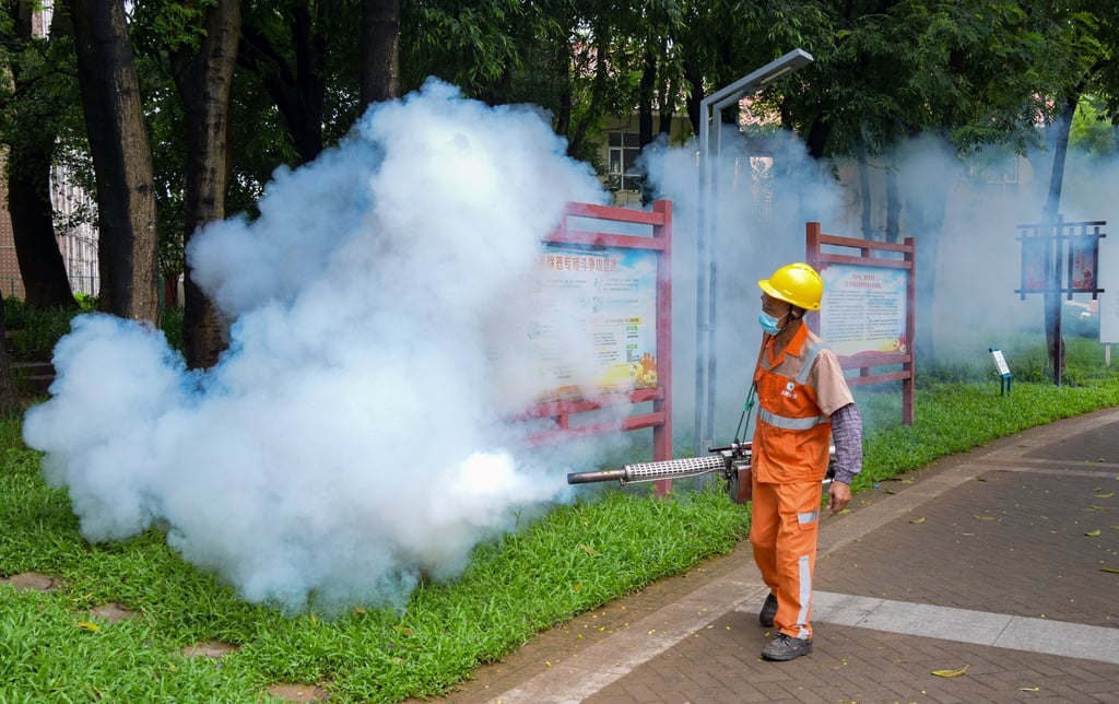 A sanitation worker sprays insecticide to prevent the spread of chikungunya on August 3 in Dongguan, Guangdong Province of China. Photo: VCG/VCG via Getty Images