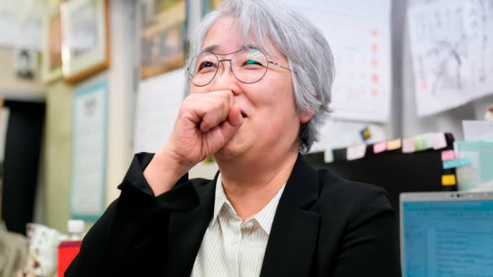 Masako Kudo reacts emotionally while speaking to members of the media at Nihon Hidankyo’s Tokyo office.