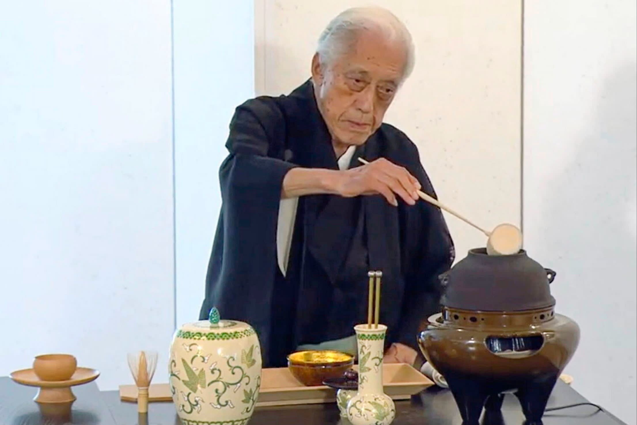 Sen Genshitsu prepares ceremonial tea using traditional utensils