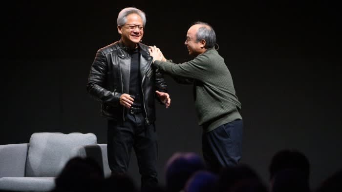 The two men are laughing