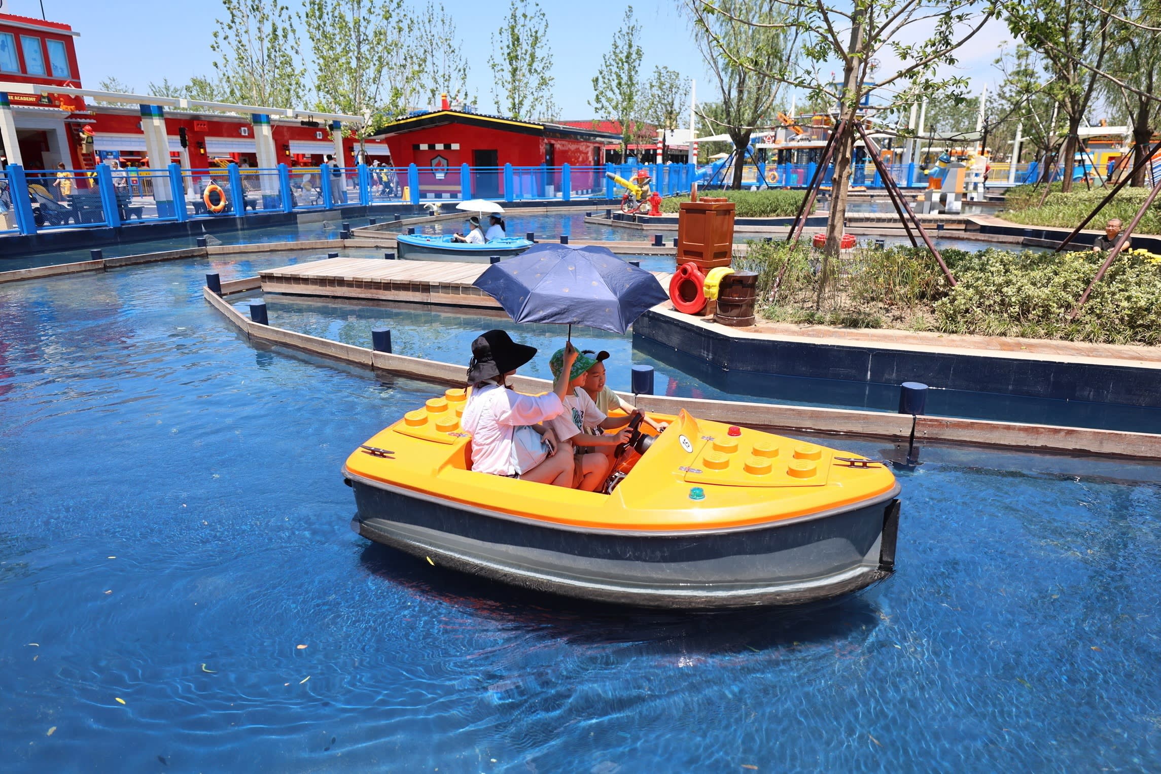 Legoland visitors in a Lego-themed boat