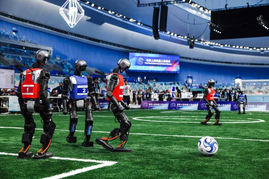 Humanoids play football during the World Humanoid Robot Games in Beijing on Friday. Photo: EPA