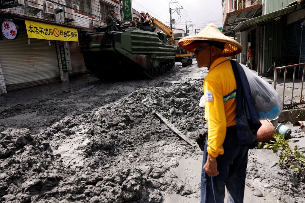A resident surveys the aftermath of a burst landslide lake in Hualien county on Wednesday. Photo: Reuters