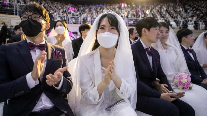 Thousands of couples at a mass wedding held by the Unification Church in South Korea in 2020