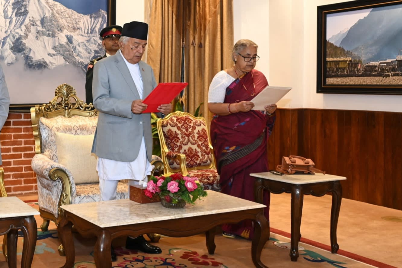 Paudel administers the oath to Karki at the president’s office in Kathmandu.