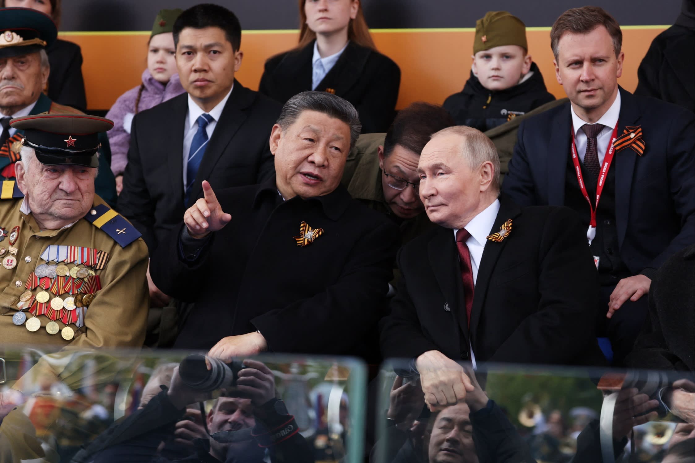 Russia’s President Vladimir Putin and Chinese President Xi Jinping attend the Victory Day military parade at Red Square in central Moscow on May 9, 2025