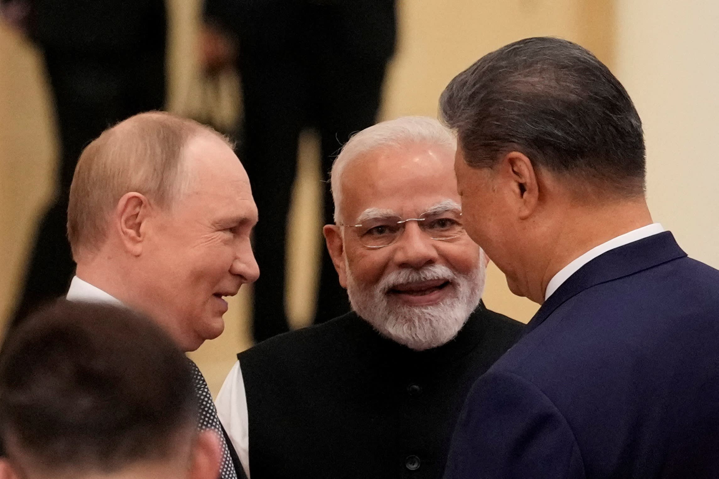 The three leaders laughing together.
