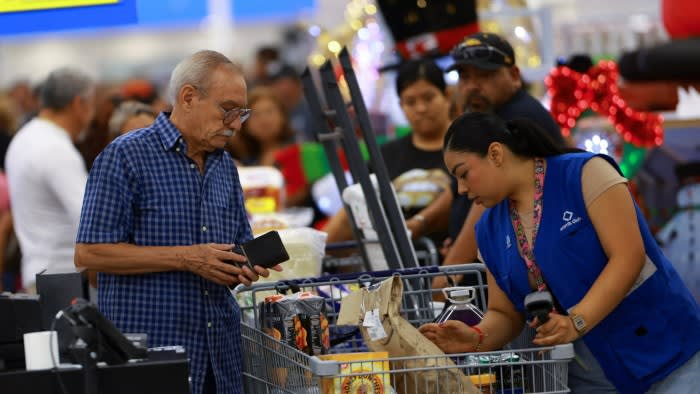 Shoppers and staff at a supermarket in Ciudad Juarez, Mexico