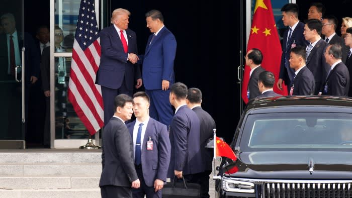 President Donald Trump and Chinese President Xi Jinping shake hands as they depart following their meeting in Busan, South Korea