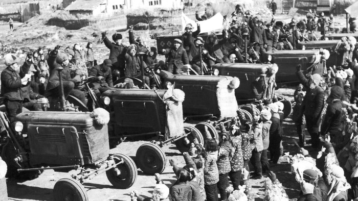 Villagers welcome the arrival of tractors during the ‘Great Leap Forward’ campaign