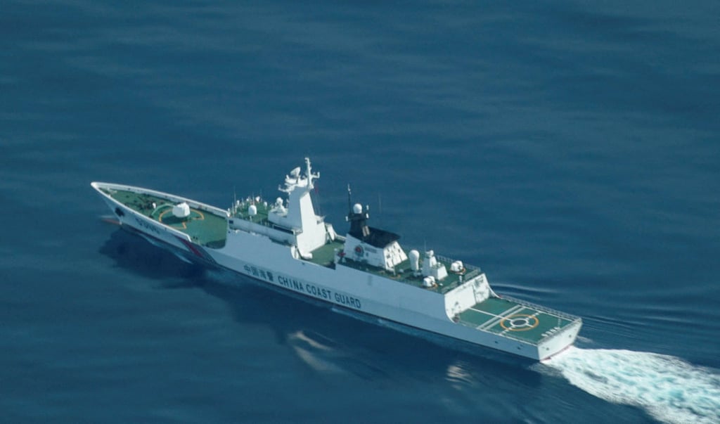 A Chinese coastguard ship sails near the disputed Scarborough Shoal in the South China Sea. Photo: Reuters A Chinese coastguard ship sails near the disputed Scarborough Shoal in the South China Sea. Photo: Reuters