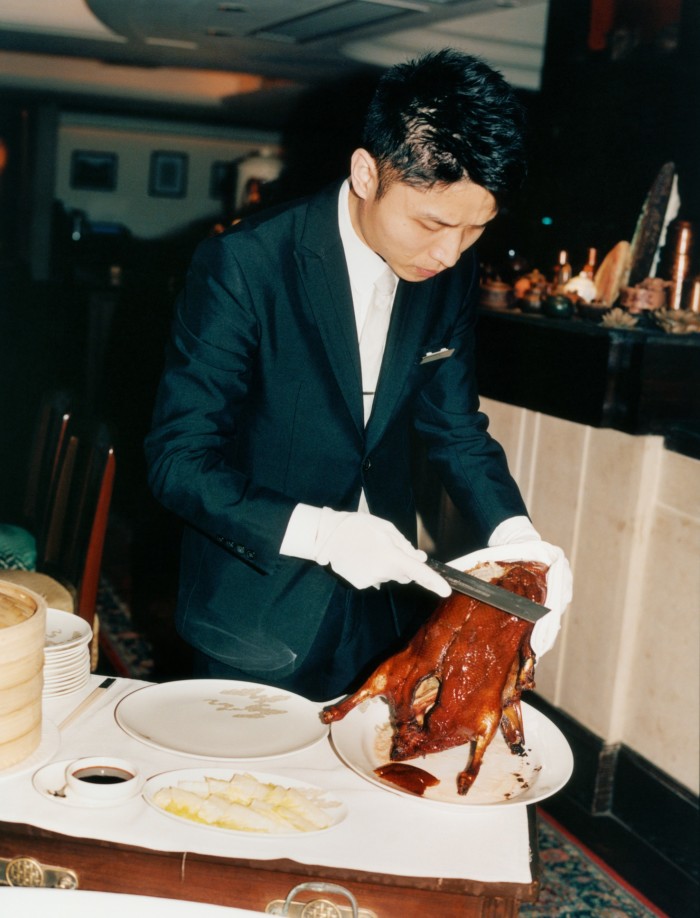 Peking duck is carved at Spring Moon