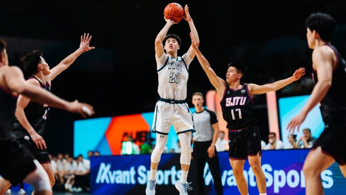 An Asian University Basketball League game between Shanghai Jiao Tong University and Taiyuan University of Technology