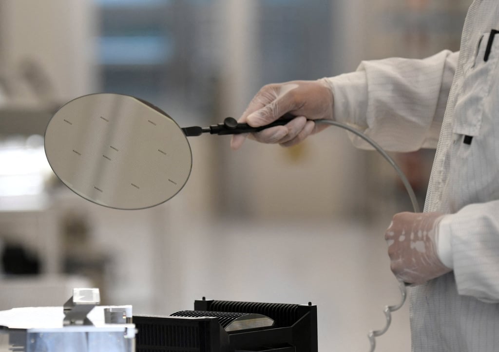 An employee works with a wafer in a production line of Nexperia. Photo: Reuters An employee works with a wafer in a production line of Nexperia. Photo: Reuters