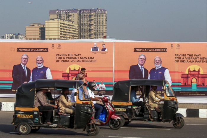 Billboards in Mumbai show Keir Starmer and Narendra Modi shaking hands, with text welcoming Starmer and promoting India-UK partnership.