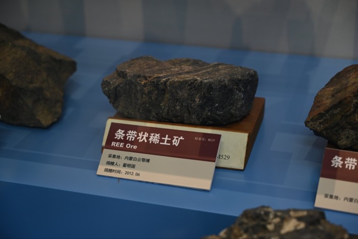 A sample of rare-earth element ore from the Baiyun'ebo mining district displayed with a label at the Institute of Geology and Geophysics.