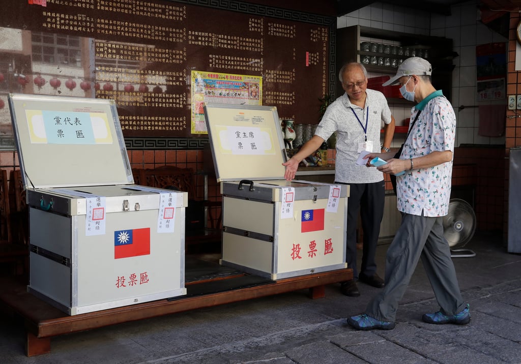 A KMT member votes in the party’s leadership election at a polling station in Taipei. Photo: AP A KMT member votes in the party’s leadership election at a polling station in Taipei. Photo: AP