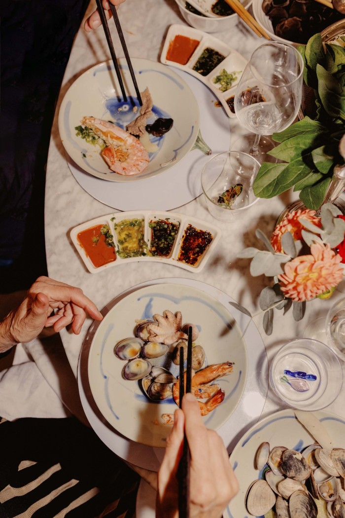 Bowls of clams, prawns and octopus with dips of fermented red&nbsp;tofu, spring onion and ginger relish, seasoned soy sauce and&nbsp;Poon’s Extraordinary Chilli Oil