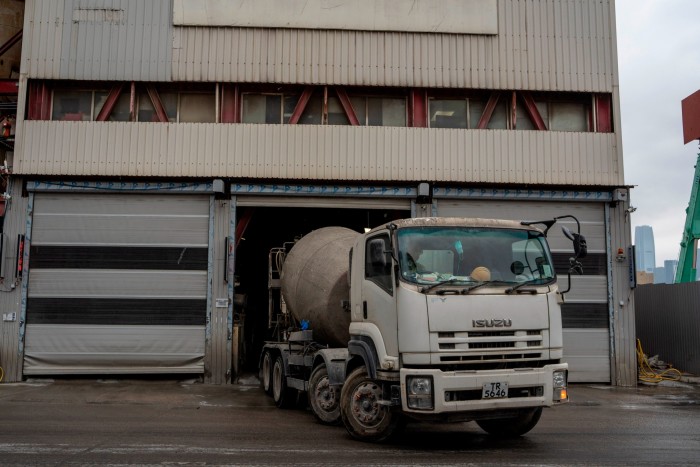 A cement truck drives out of the China Concrete Co, Ltd. factory.