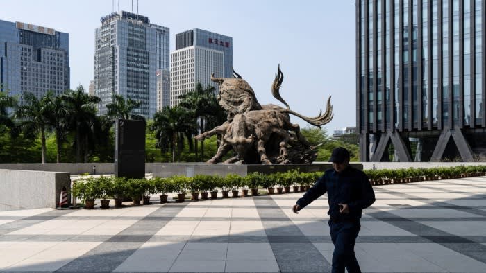 Statues of bulls at the Shenzhen Stock Exchange in Shenzhen, China