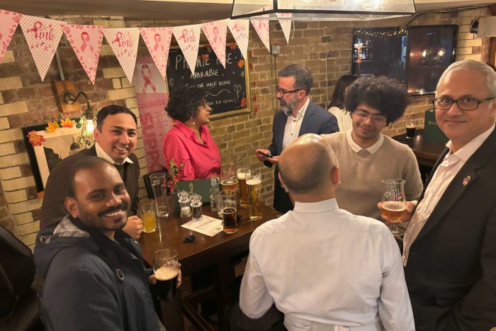 A group photo of Tee Zhuo and Veena Venugopal with India Business Briefing readers