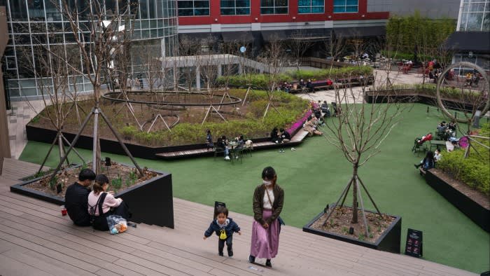 a mother and her child in a park