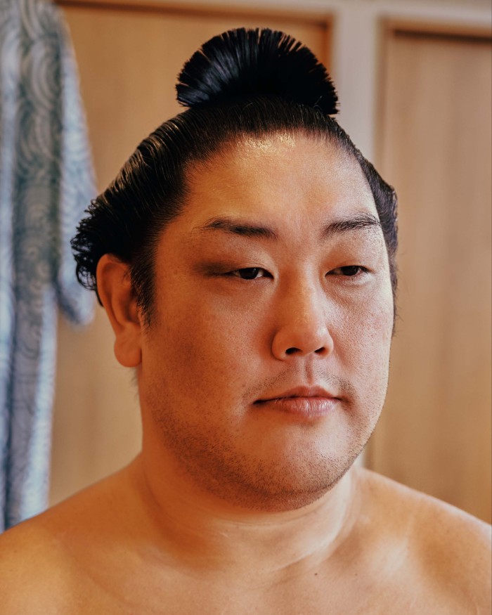 The delicate Ōichō topknot is styled to replicate the look of a ginkgo-leaf-shaped fan