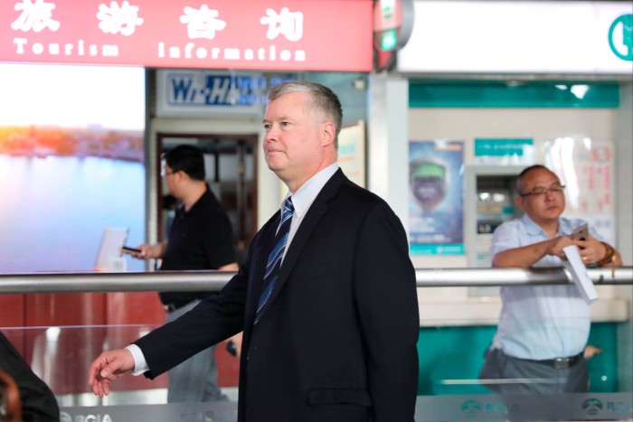 Stephen Biegun walks through Beijing International Airport in 2018.