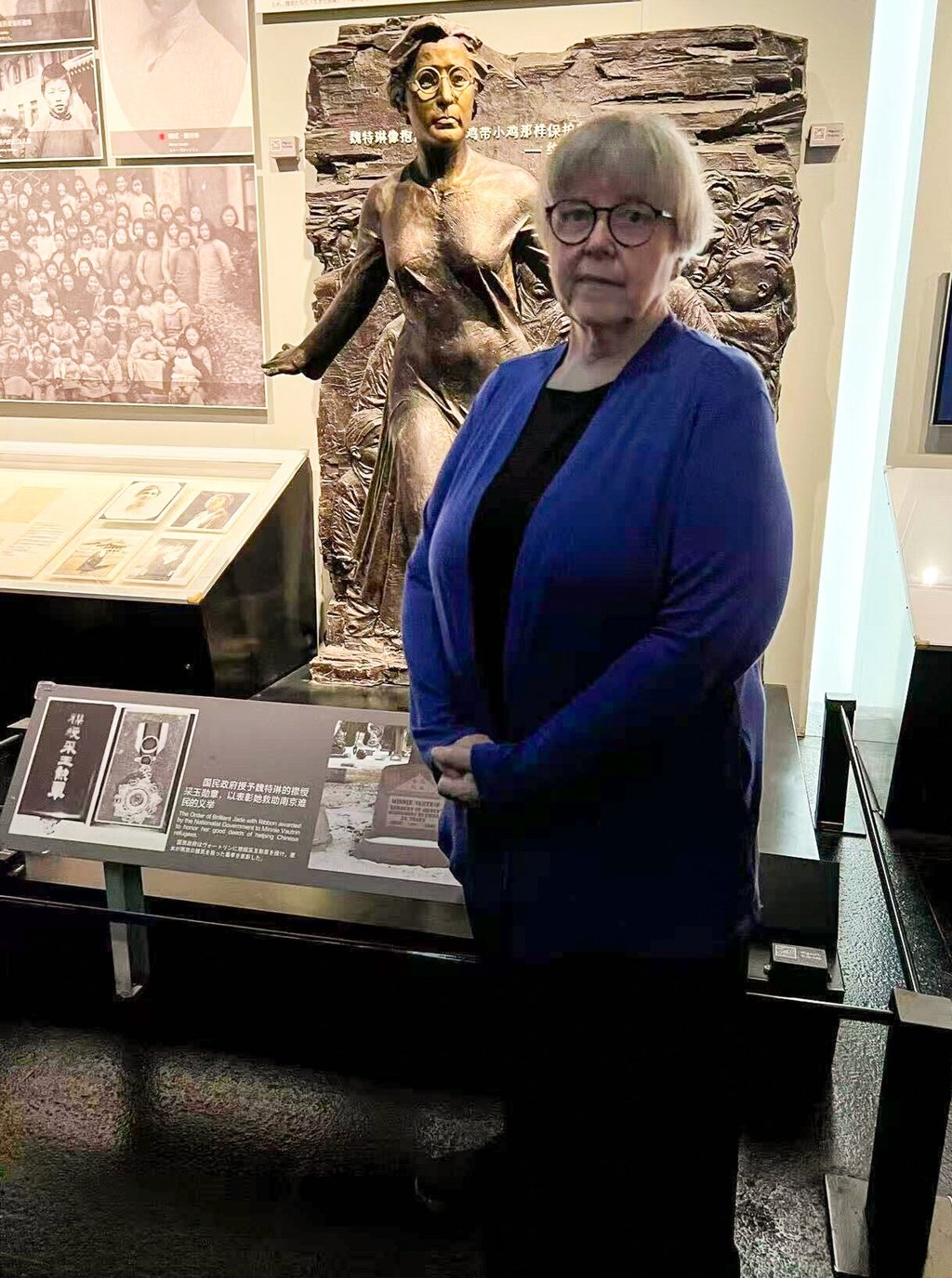 Elyn MacInnis stands before a statue of Minnie Vautrin, who was an American missionary during the Nanking massacre of 1937. Photo: Handout Elyn MacInnis stands before a statue of Minnie Vautrin, who was an American missionary during the Nanking massacre of 1937. Photo: Handout