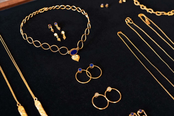 A selection of gold-plated silver jewellery handcrafted in Afghanistan, including lapis lazuli Infinite choker, £320; Love Drop earrings in lapis lazuli or marble, £110; and Asman and Zamen stud earrings in lapis lazuli or Bamiyan turquoise (with detachable hoop), £75