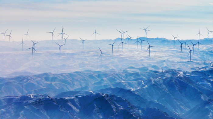 Wind turbines stand on the mountain peak at Niushou Mountain Wind Farm in Qingtongxia City, Ningxia Hui Autonomous Region, China