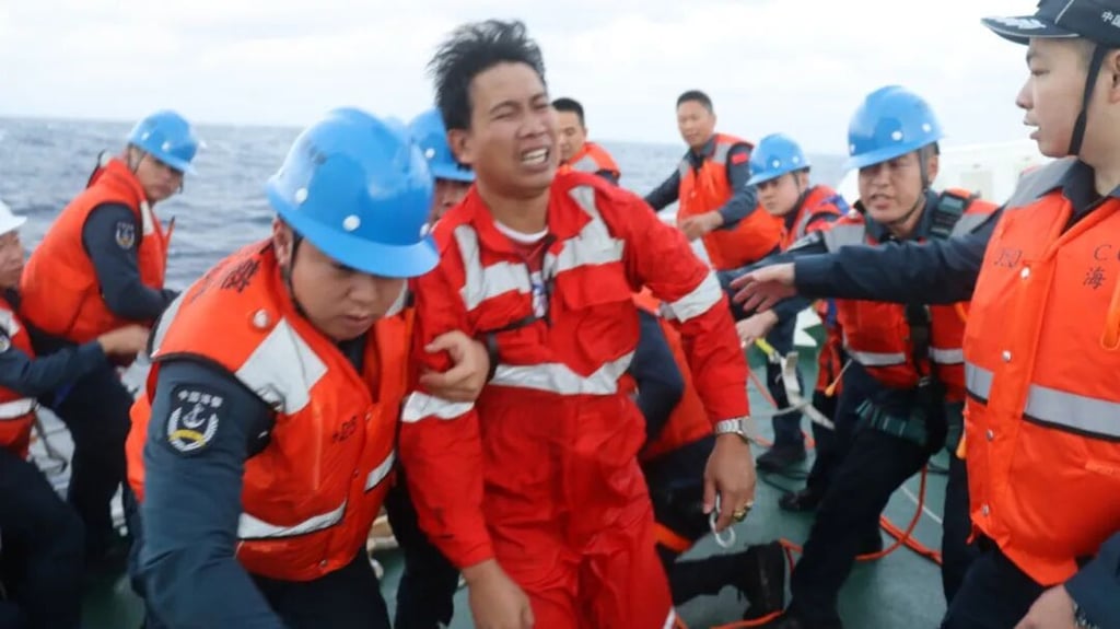 Some members of a Singapore-flagged cargo ship are rescued by Chinese coastguard crew near the disputed Scarborough Shoal on Friday. Photo: China Coast Guard Some members of a Singapore-flagged cargo ship are rescued by Chinese coastguard crew near the disputed Scarborough Shoal on Friday. Photo: China Coast Guard