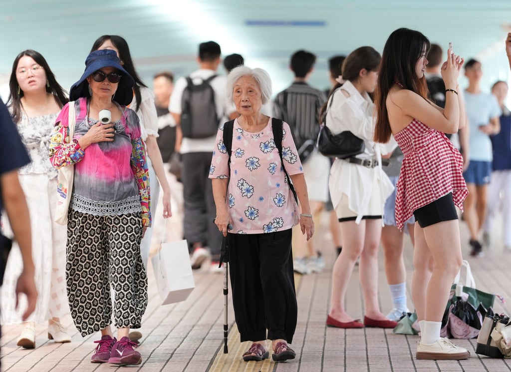 A senior resident walks on a bridge in Mong Kok on September 2, 2025. Photo: Jelly Tse