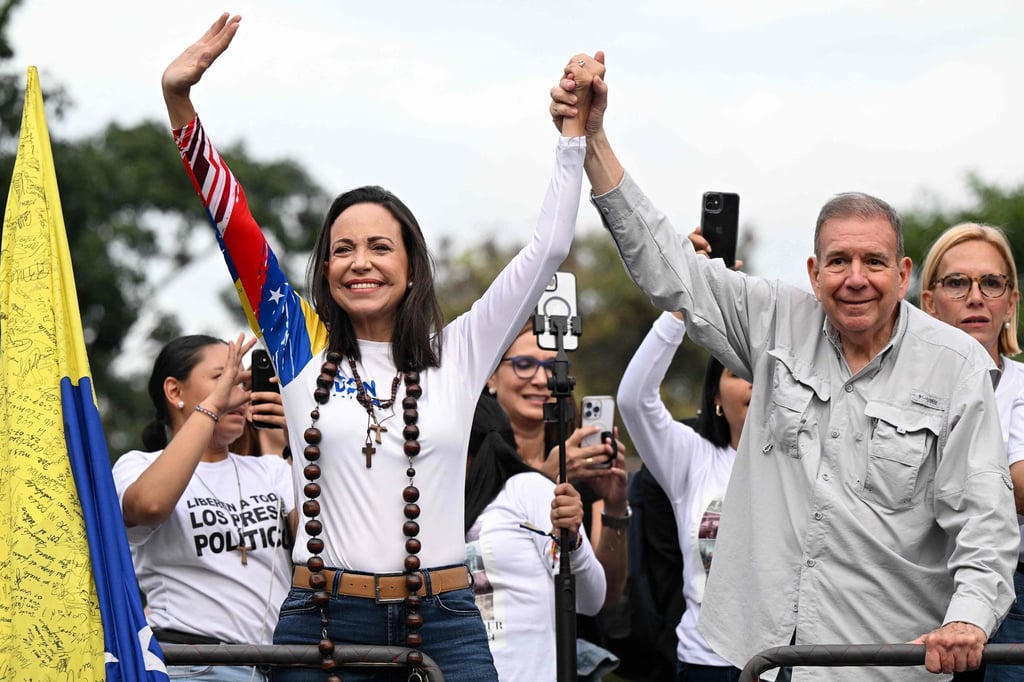 Venezuelan opposition presidential candidate Edmundo Gonzalez Urrutia and opposition leader Maria Corina Machado during their campaign closing rally in Caracas in July. Photo: AFP Venezuelan opposition presidential candidate Edmundo Gonzalez Urrutia and opposition leader Maria Corina Machado during their campaign closing rally in Caracas in July. Photo: AFP