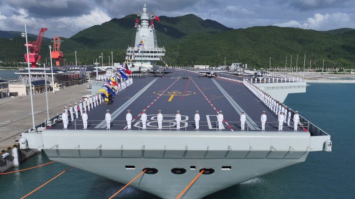 Chinese navy personnel line the deck of the Fujian during its November 5 commissioning ceremony