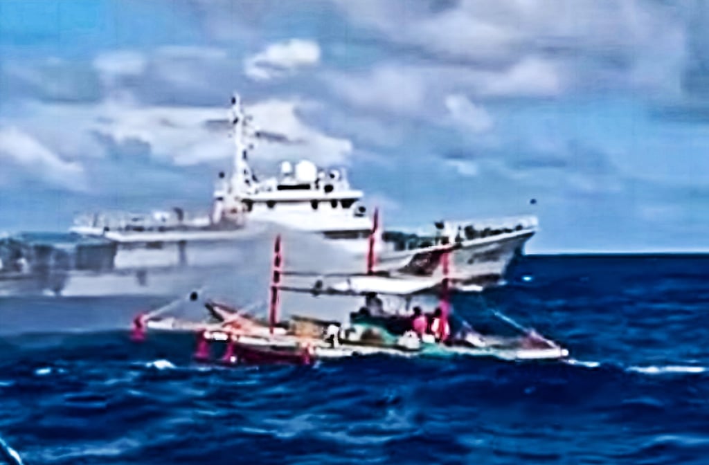 A frame from the video released by the Philippine Coast Guard in December of what it said showed a Chinese vessel deploying water cannon towards a fishing boat near Sabina Shoal in the South China Sea. Photo: Handout A frame from the video released by the Philippine Coast Guard in December of what it said showed a Chinese vessel deploying water cannon towards a fishing boat near Sabina Shoal in the South China Sea. Photo: Handout