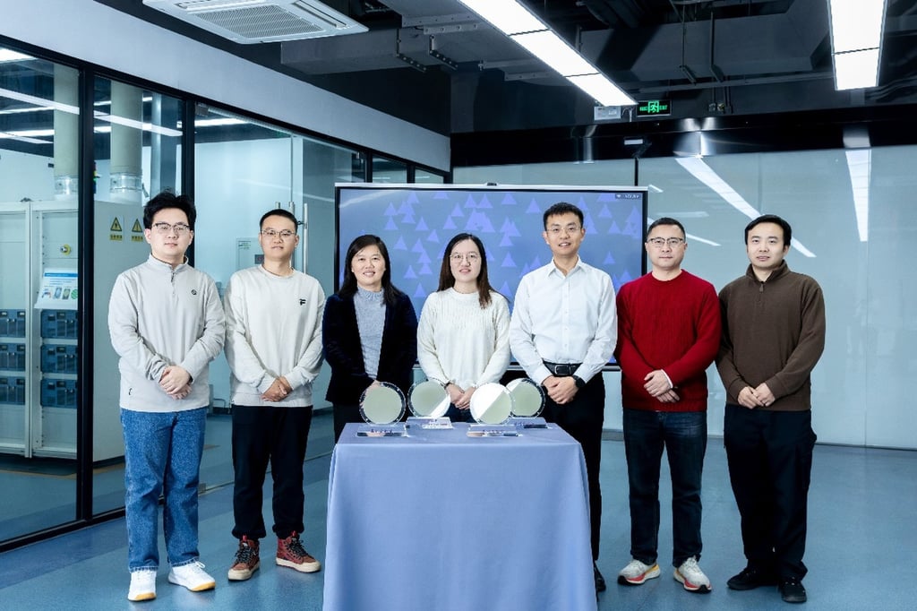 A team led by Wang Jinlan (third left) from Southeast University in Nanjing has announced a breakthrough technique to mass produce 2D material wafers on January 29. Photo: Handout A team led by Wang Jinlan (third left) from Southeast University in Nanjing has announced a breakthrough technique to mass produce 2D material wafers on January 29. Photo: Handout