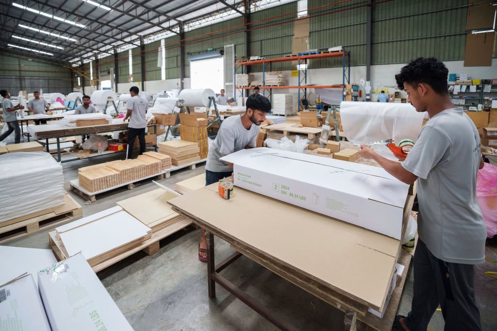 Workers pack furniture for shipping to the US on the outskirts of Muar, in Johor state, Malaysia, on April 11, 2025. Photo: AP