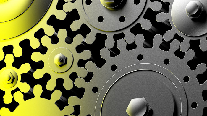 A close-up illustration shows interlocking metal gears in yellow and grey