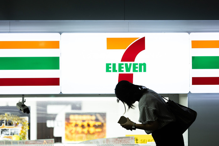 A shopper inside a 7-Eleven convenience store, operated by Seven & i Holdings Co, in Tokyo